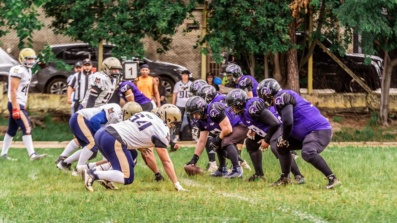 American football teams lined up before the snap
